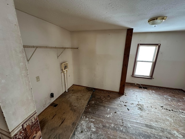 washroom with a textured ceiling