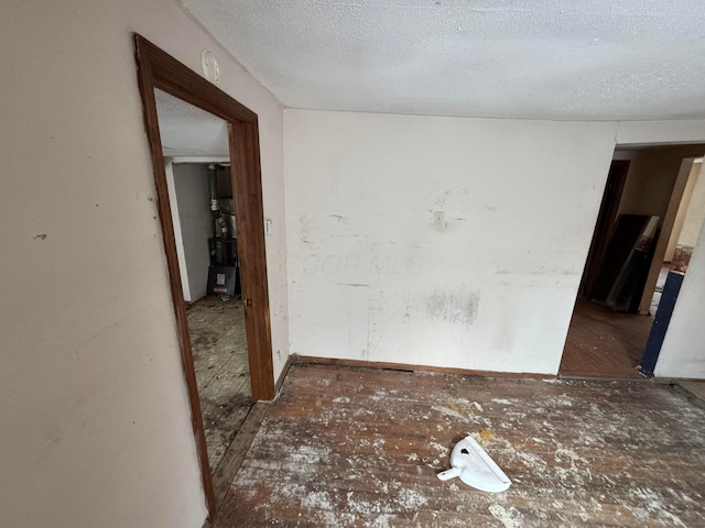 spare room with a textured ceiling