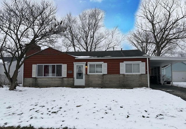 view of front facade with a carport