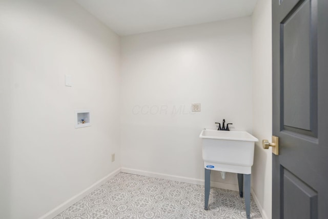 laundry area with light tile patterned floors and hookup for a washing machine