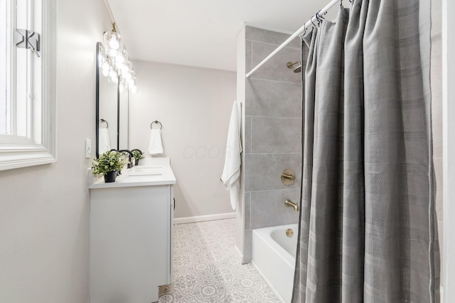 bathroom with tile patterned flooring, vanity, and shower / bath combo with shower curtain