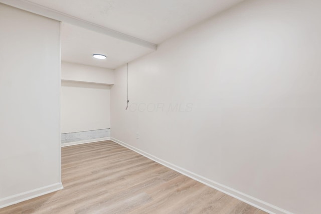 spare room featuring light hardwood / wood-style floors