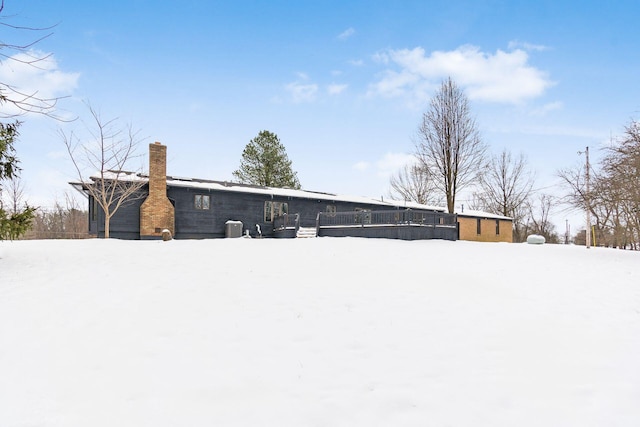 yard covered in snow featuring central AC