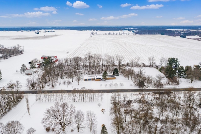 snowy aerial view featuring a rural view