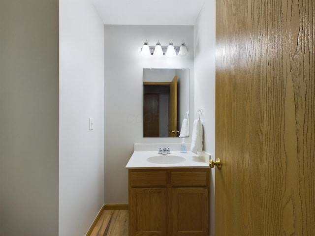 bathroom featuring hardwood / wood-style floors and vanity