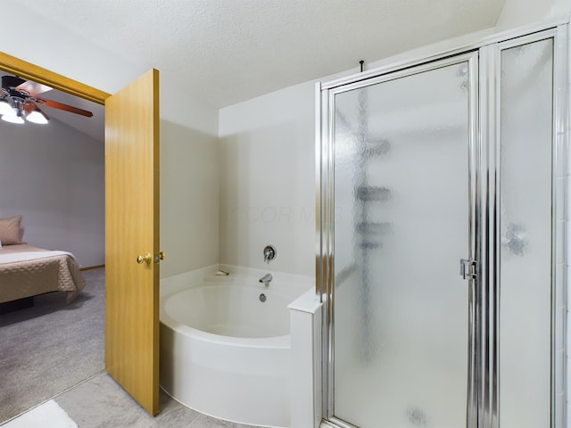 bathroom featuring ceiling fan, a textured ceiling, tile patterned floors, and shower with separate bathtub