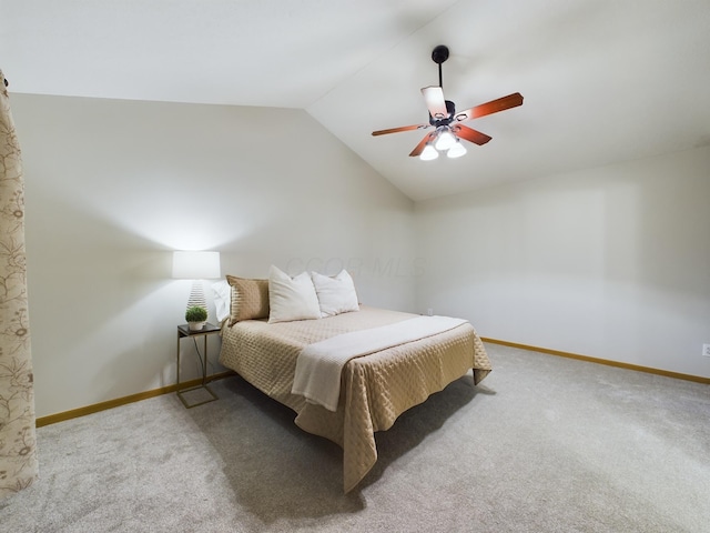 bedroom featuring ceiling fan, light carpet, and vaulted ceiling