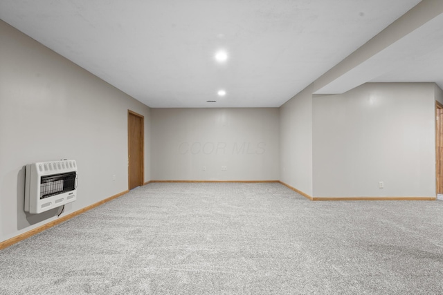 interior space featuring carpet floors and heating unit