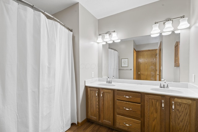 bathroom featuring vanity and hardwood / wood-style floors