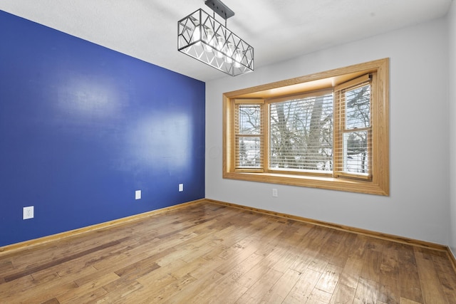 spare room featuring hardwood / wood-style flooring