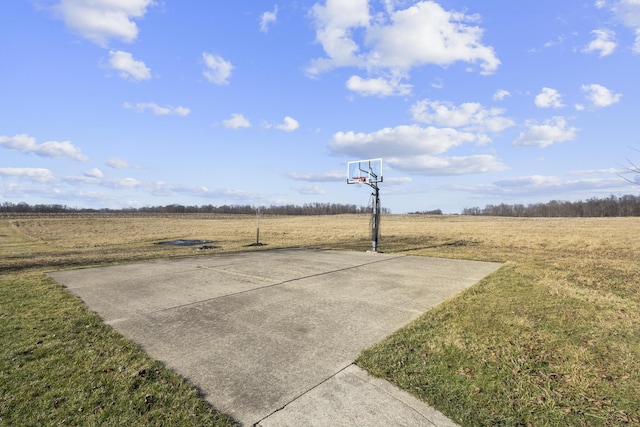 view of patio / terrace with a rural view and basketball court