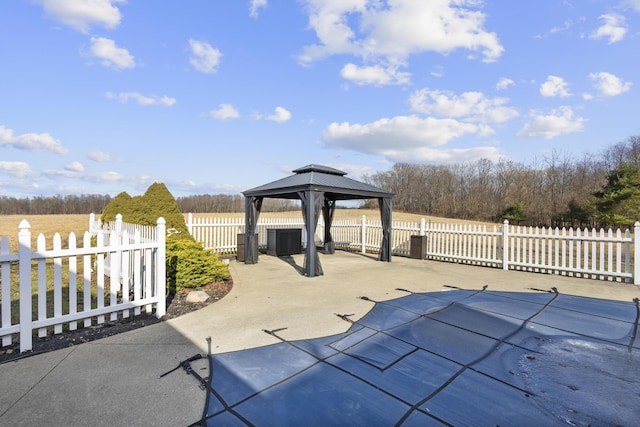 view of patio / terrace featuring a gazebo and a covered pool