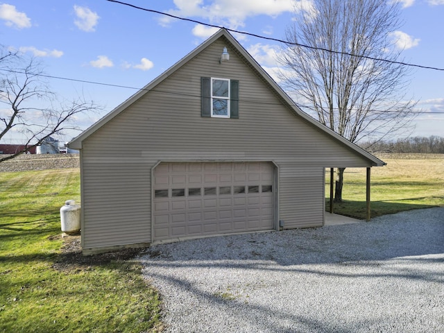 garage featuring a lawn