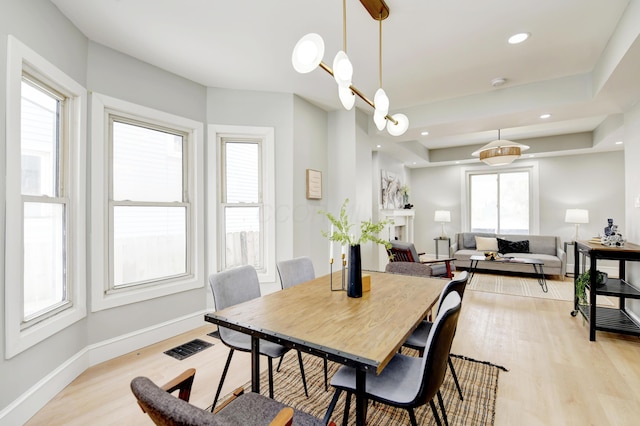 dining space with light wood-type flooring