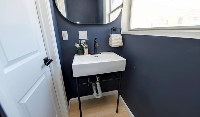 bathroom with sink and hardwood / wood-style floors