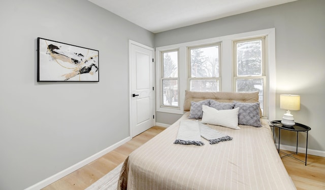 bedroom with light hardwood / wood-style flooring