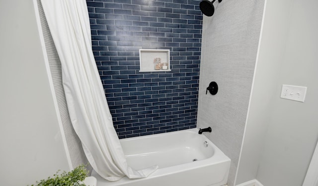 bathroom with shower / bathtub combination with curtain