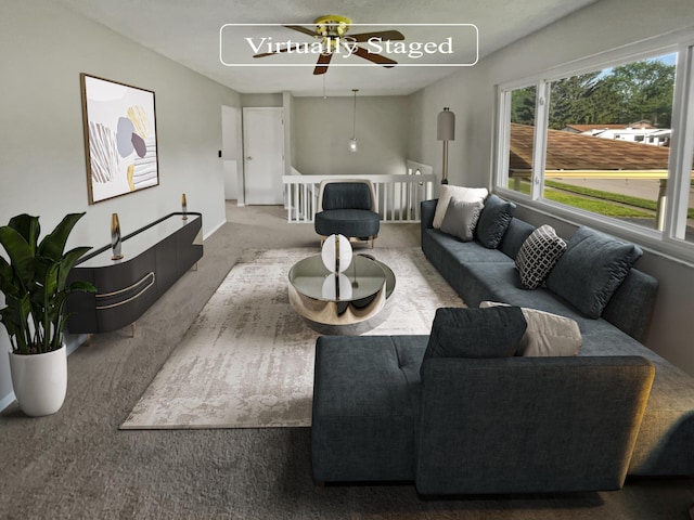 carpeted living room with ceiling fan