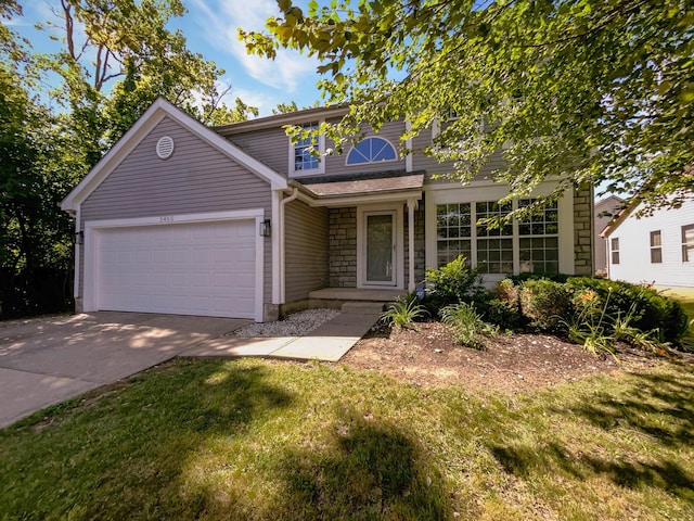 view of front facade featuring a front lawn and a garage