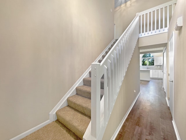 stairway featuring hardwood / wood-style floors