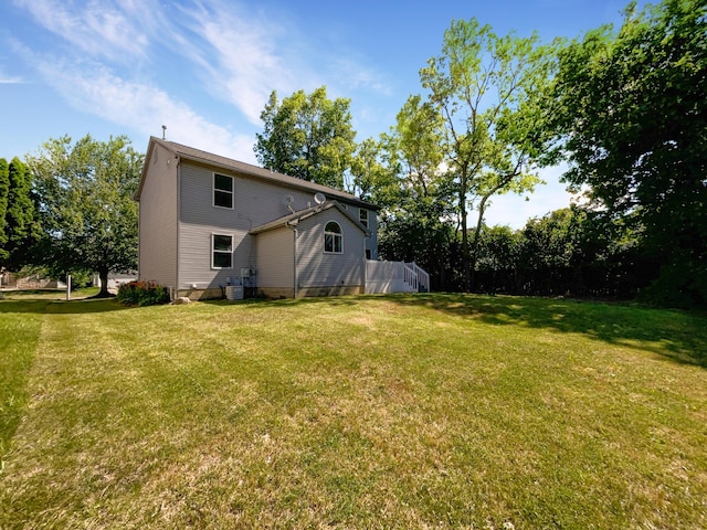 view of yard featuring central AC