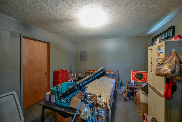 22 Fairlawn Ave, Glouster, OH 45732 - bedroom featuring electric panel, a textured ceiling, and concrete flooring