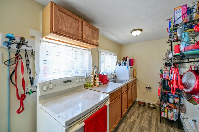 22 Fairlawn Ave, Glouster, OH 45732 - kitchen with white electric stove, dark wood-type flooring, brown cabinetry, light countertops, and a textured ceiling