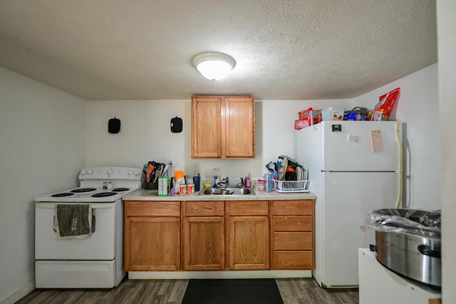 22 Fairlawn Ave, Glouster, OH 45732 - kitchen featuring white appliances, dark wood finished floors, light countertops, brown cabinets, and a textured ceiling