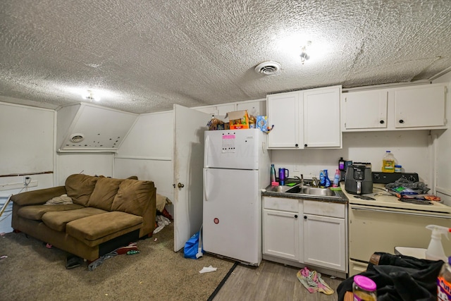 22 Fairlawn Ave, Glouster, OH 45732 - kitchen featuring white appliances, white cabinetry, a textured ceiling, and light wood-type flooring
