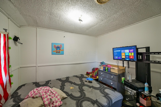 22 Fairlawn Ave, Glouster, OH 45732 - bedroom with a textured ceiling, a decorative wall, and carpet flooring