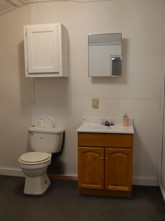 bathroom with toilet and vanity