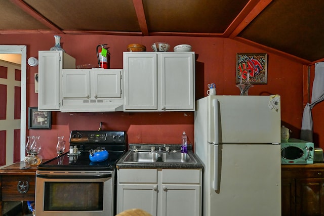 18 N Ave, Glouster, OH 45732 - kitchen with freestanding refrigerator, under cabinet range hood, electric stove, and white cabinetry