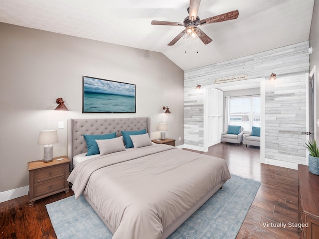 bedroom featuring vaulted ceiling, ceiling fan, wood finished floors, and baseboards