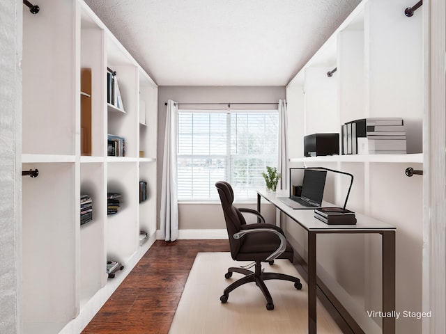 office area with dark wood finished floors and baseboards