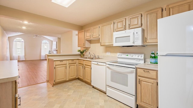 kitchen featuring ceiling fan, kitchen peninsula, sink, white appliances, and light brown cabinetry