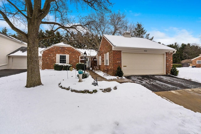 view of snow covered exterior featuring a garage