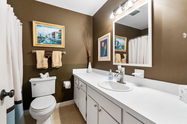 bathroom featuring tile patterned floors, toilet, and vanity