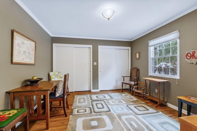 home office featuring ornamental molding and hardwood / wood-style flooring