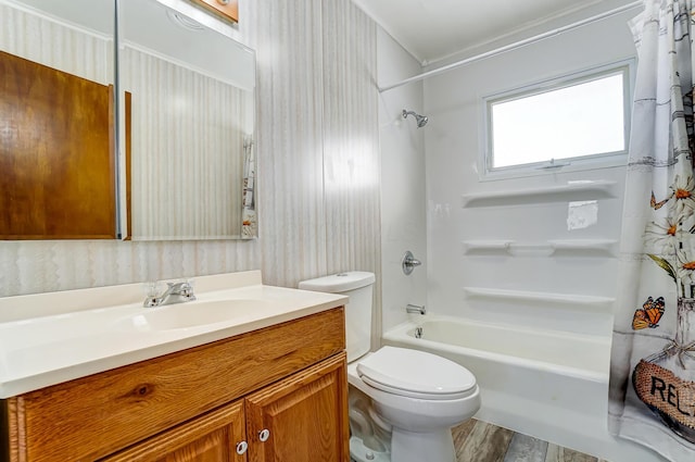 full bathroom with toilet, hardwood / wood-style flooring, vanity, and shower / bath combo with shower curtain