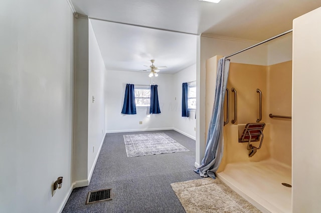 bathroom featuring ceiling fan and a shower with curtain