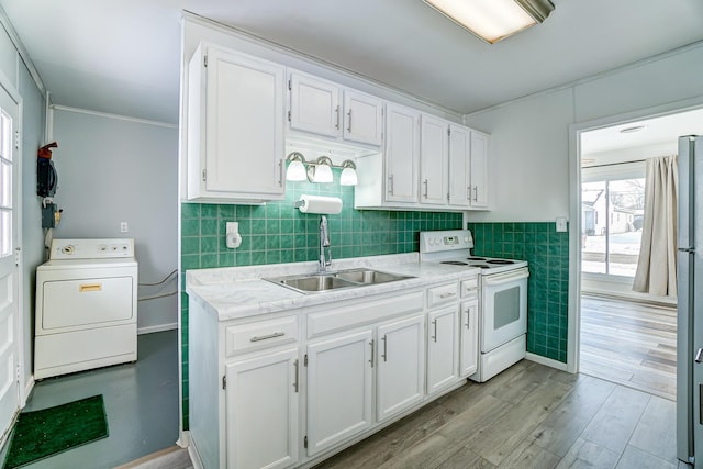 kitchen featuring sink, white cabinets, white electric stove, and washer / dryer