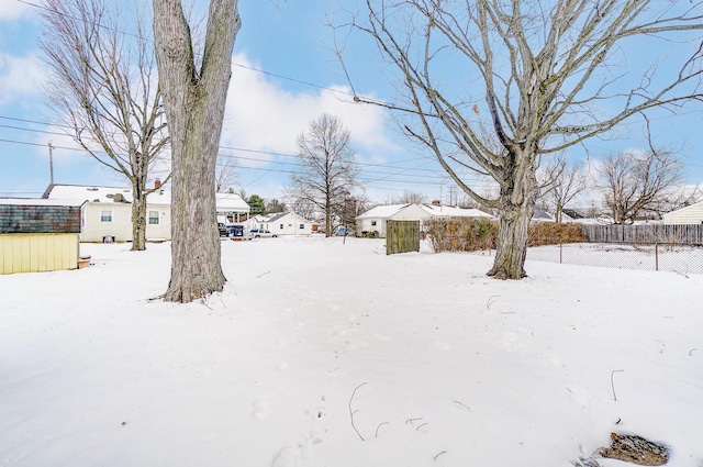 view of yard layered in snow