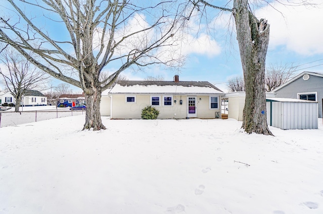 view of snow covered house