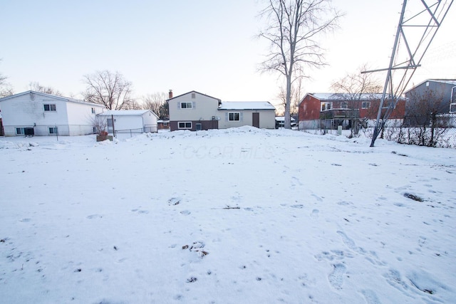 view of yard layered in snow