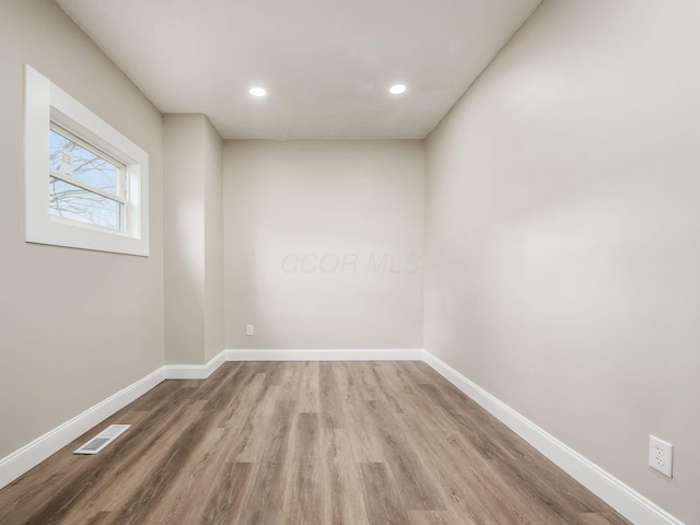 empty room with light wood-type flooring