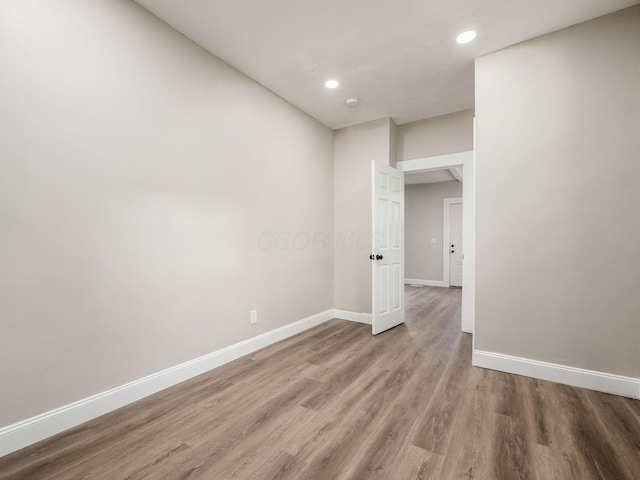 spare room featuring light hardwood / wood-style flooring