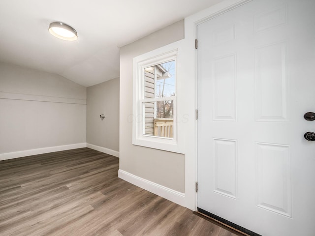 bonus room featuring hardwood / wood-style floors and vaulted ceiling