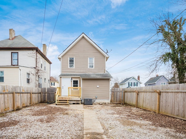 rear view of property featuring central air condition unit