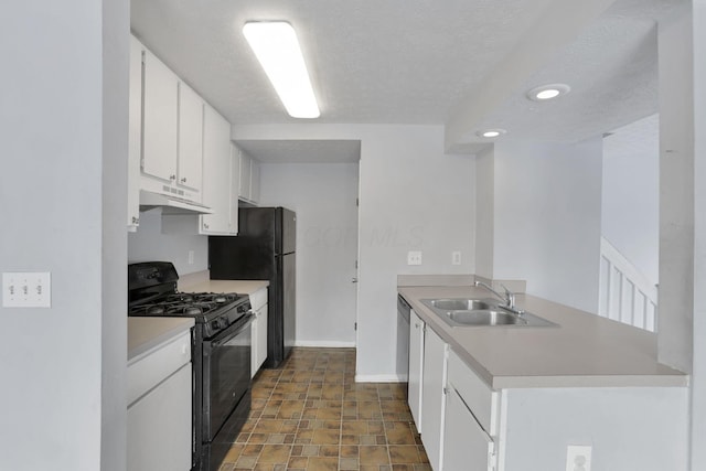 kitchen featuring sink, white cabinetry, black appliances, and a textured ceiling