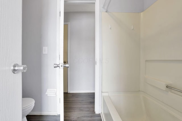 bathroom featuring wood-type flooring and toilet